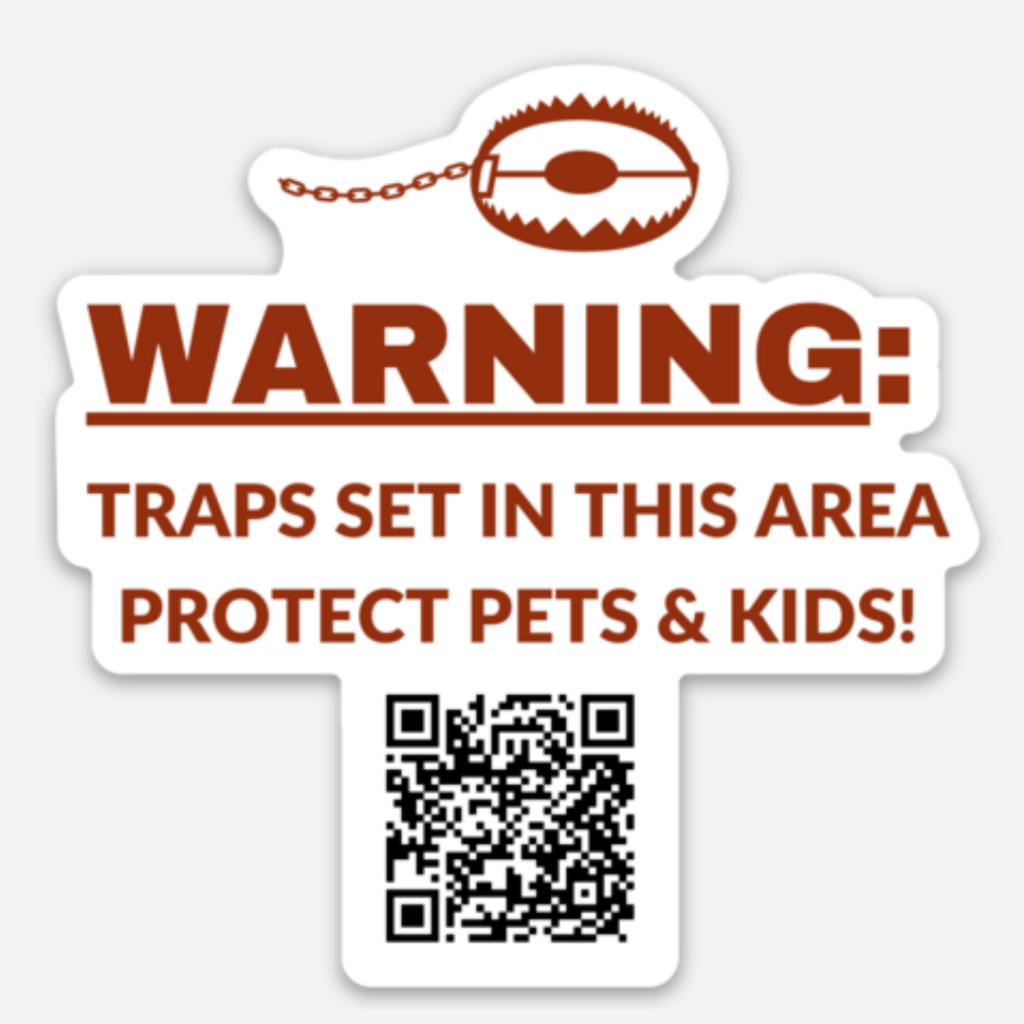 WildlifeforAll-TrapAwareSticker A die cut sticker with an image of a trap at the top and a QR code at the bottom reads, "Warning: traps set in this area. Protect pets and kids."