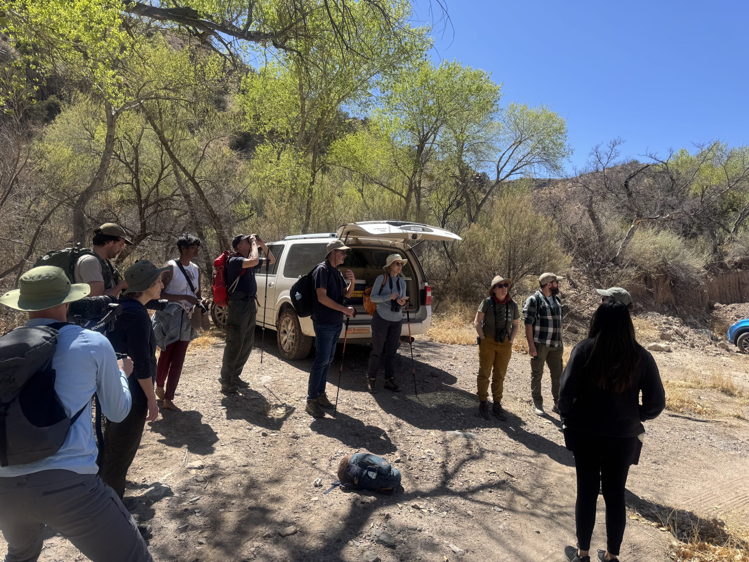 Members of the Wildlife for All staff, board, and advisory board prepare for a hike to remotely view Mexican gray wolves at the start of LoboWeek 2025. 